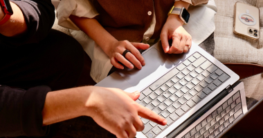 person typing on laptop